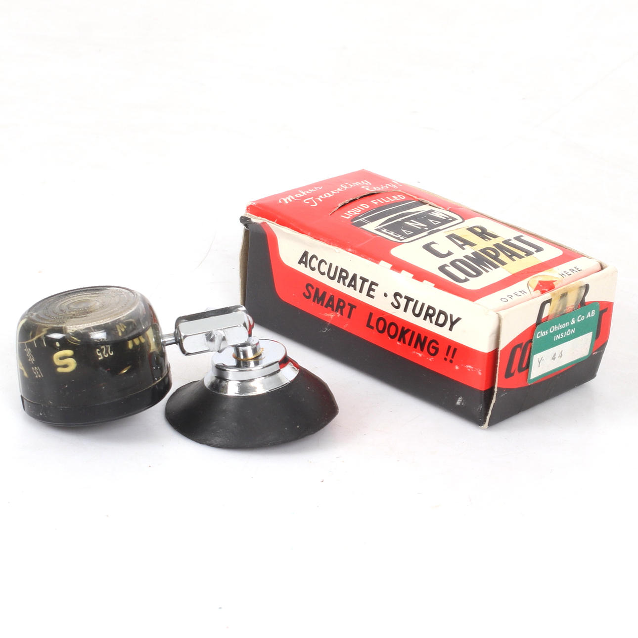 A cardboard car compass, 20th century.