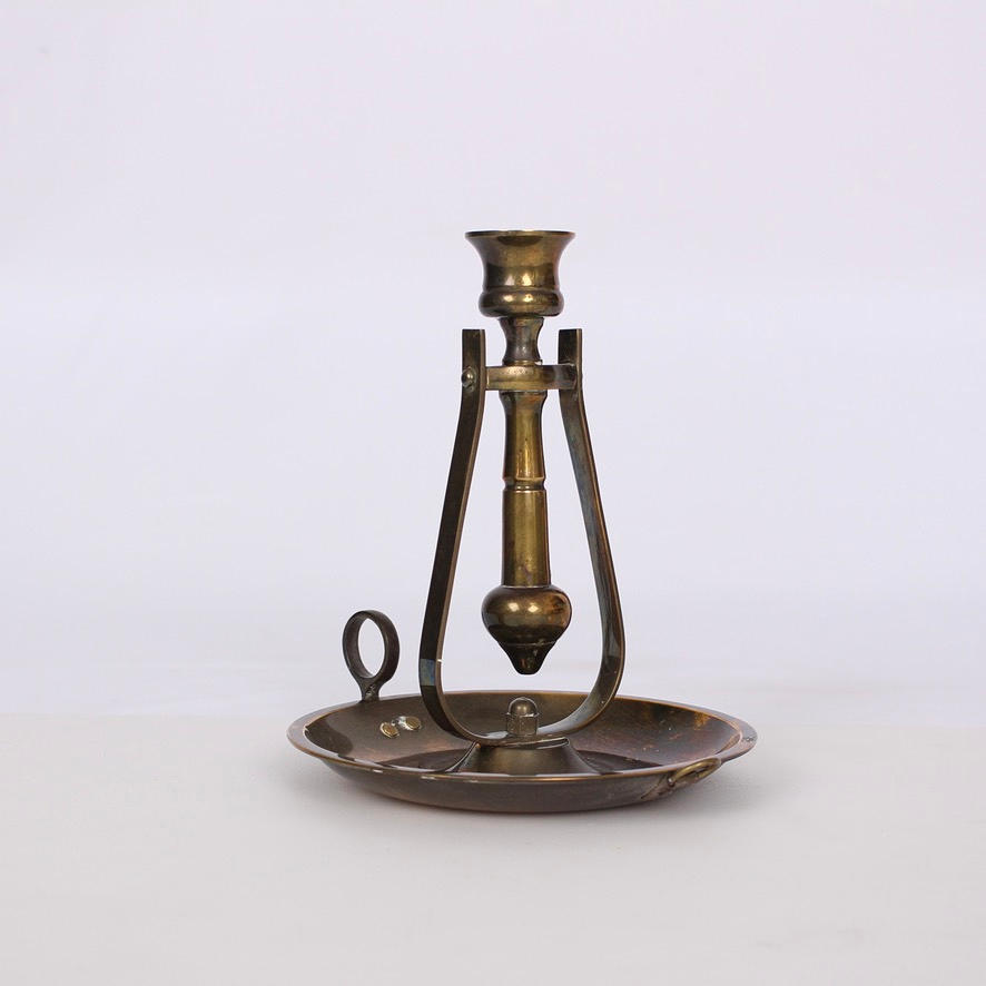 A 20th-century brass scepter candlestick.