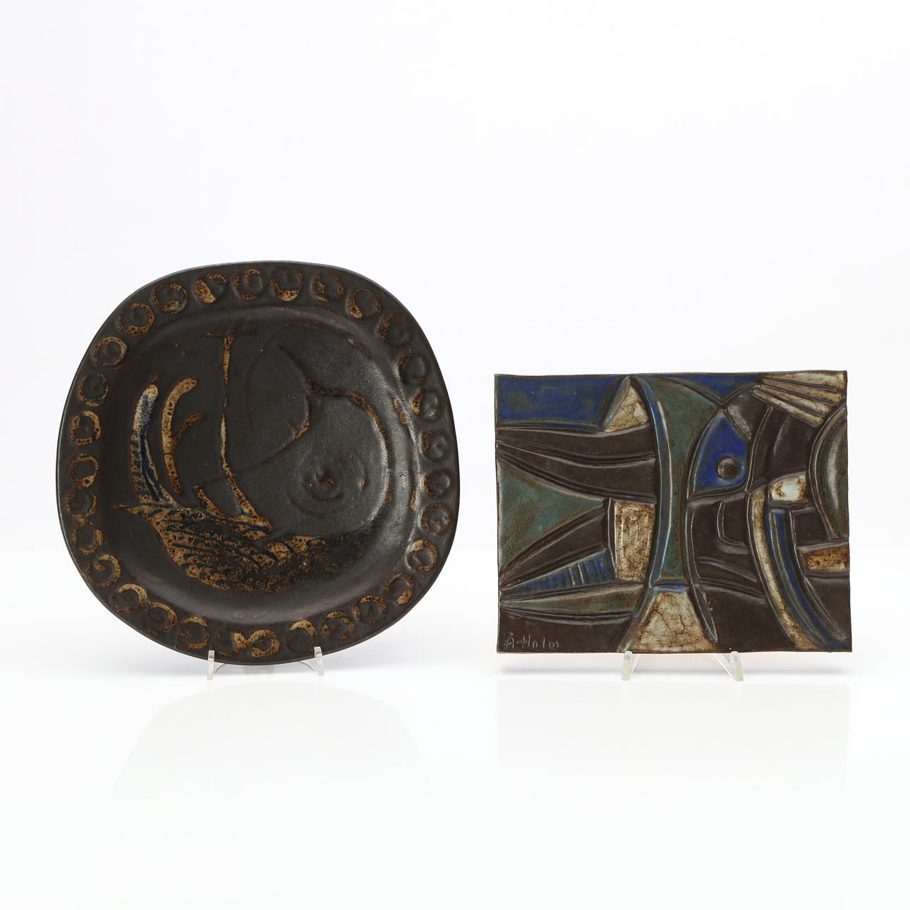 ÅKE HOLM. WALL PLAQUE AND SAUCER, Glazed ceramic, Signed.