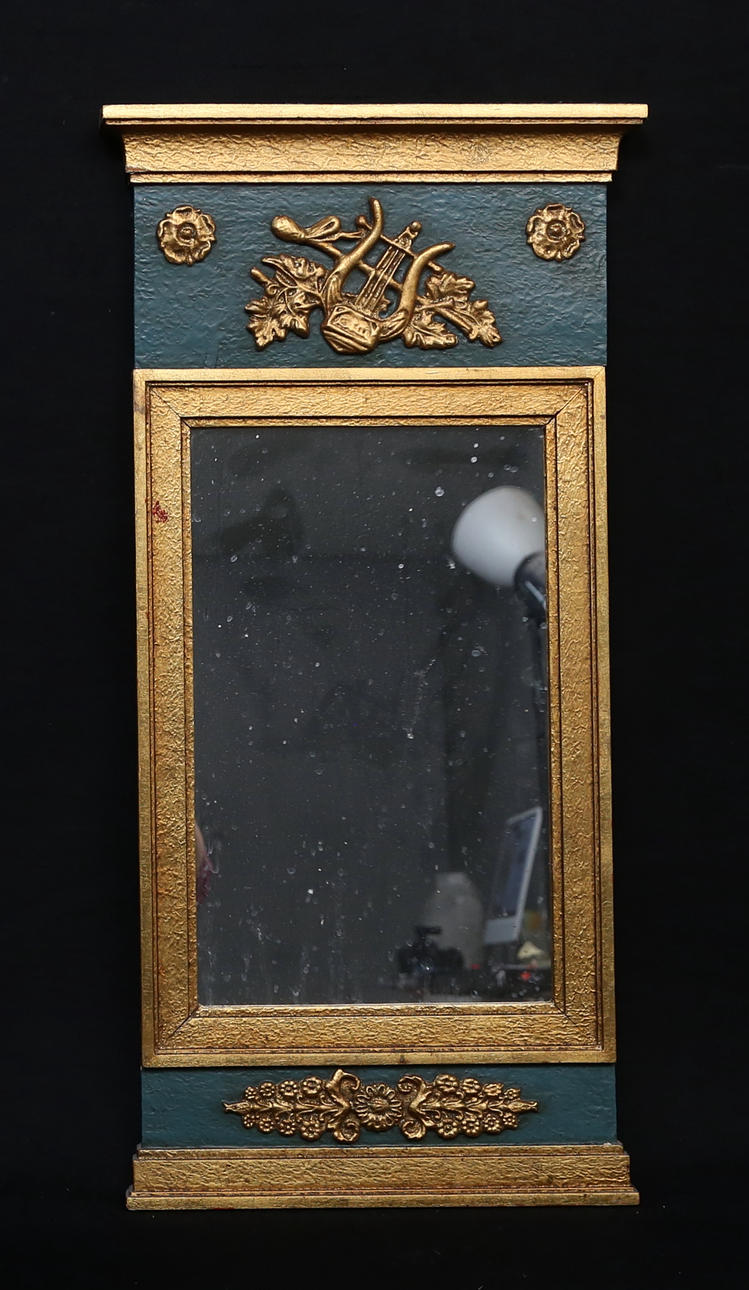 A 20th century Empire style mirror.