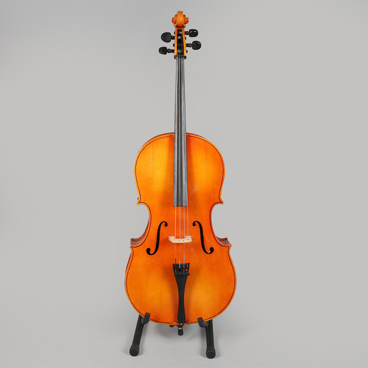 A CASED HUNGARIAN 1/2 CELLO.