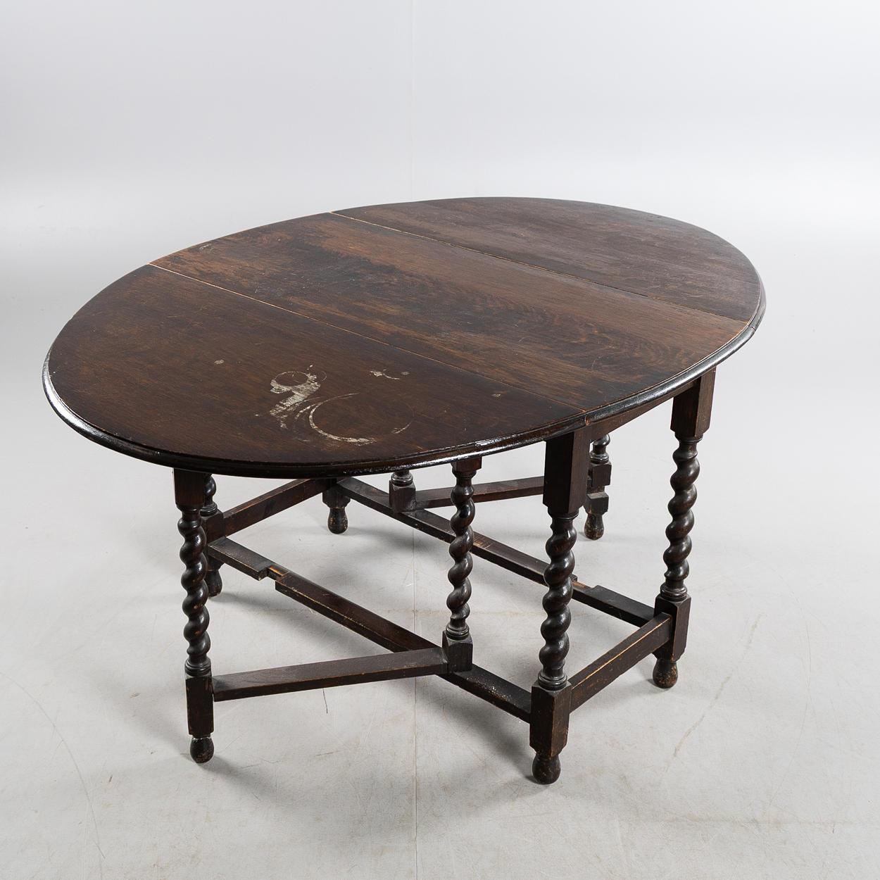 A 20th-century oak baroque folding table.