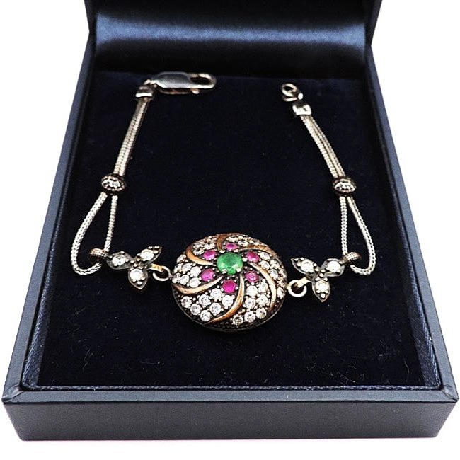 VINTAGE ARTISAN SILVER EMERALD, RUBY & WHITE GEMSTONE BRACELET.