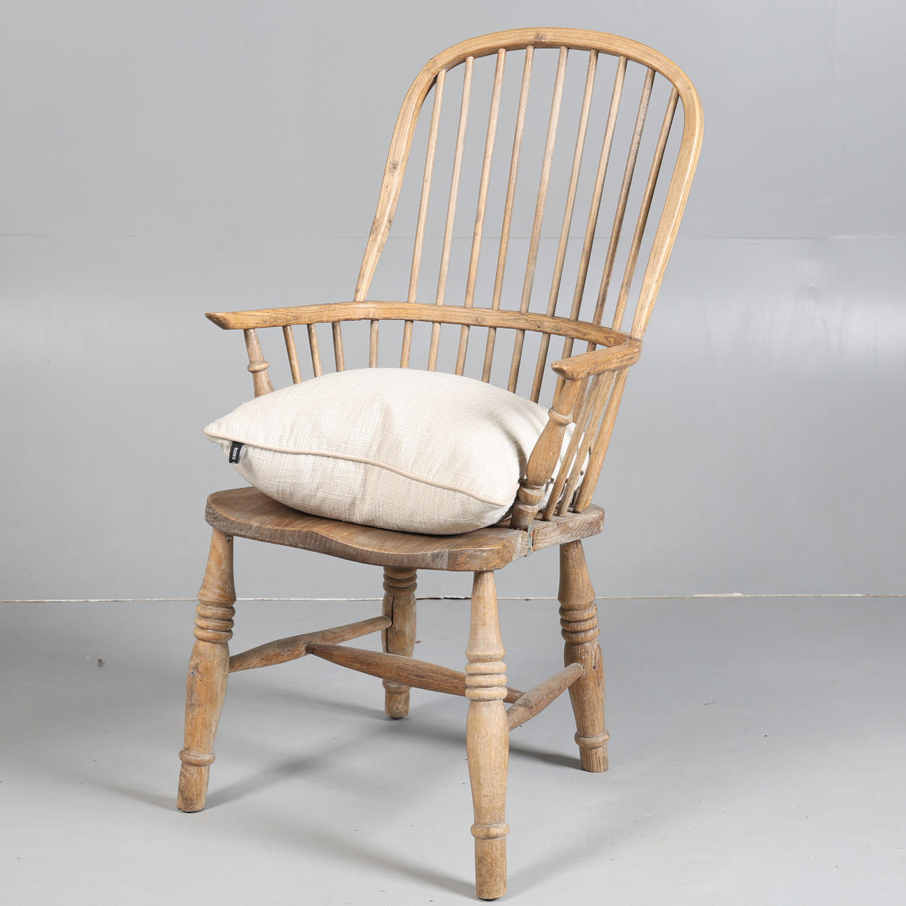A 19TH CENTURY ELM WINDSOR ARMCHAIR.