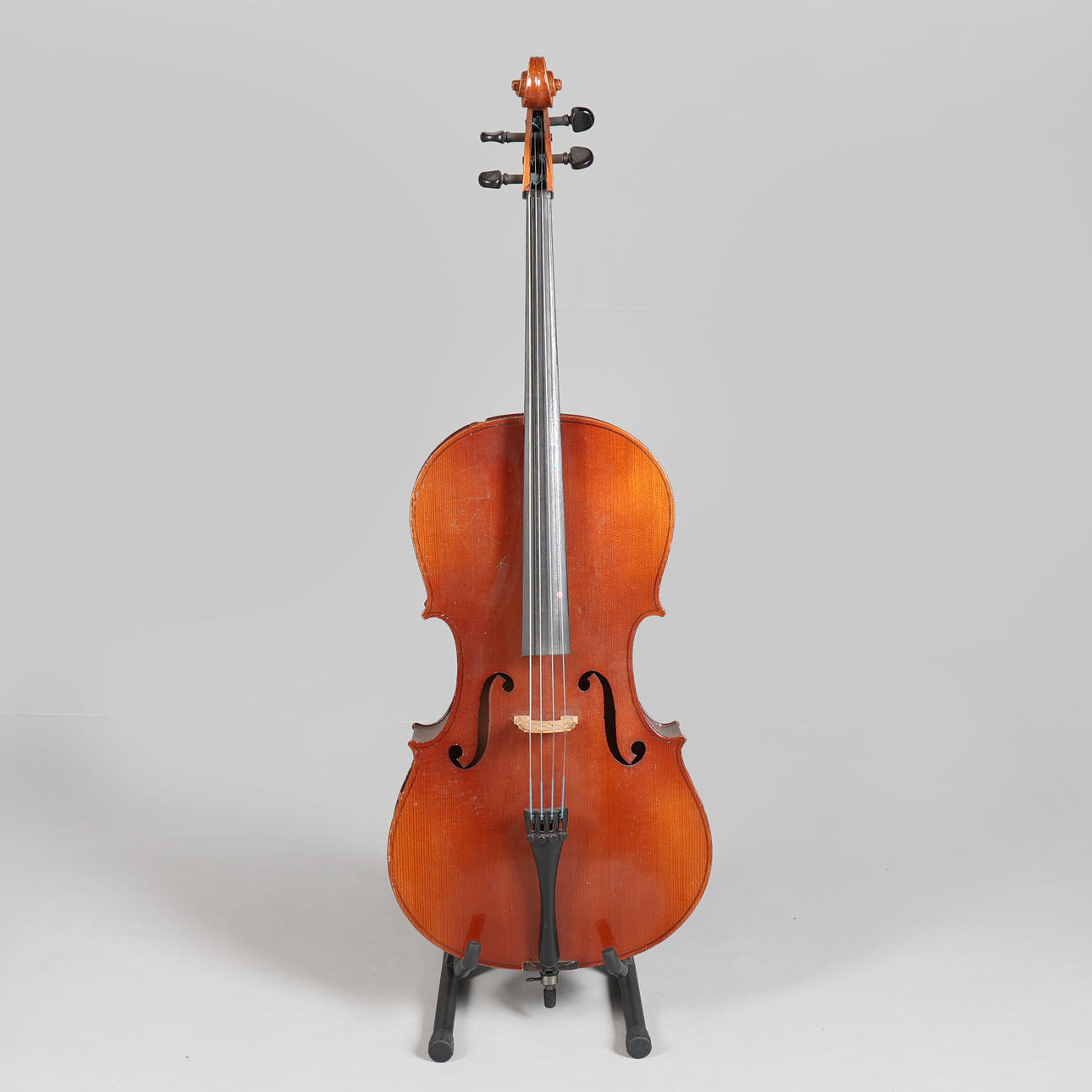 A CASED 3/4 CELLO AND BOW.