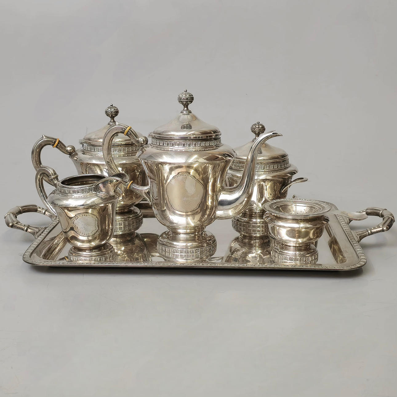 COFFEE AND TEA SET WITH PUNCHED SILVER TRAY AND BORDER ENRICHED WITH GEOMETRIC PATTERNS.