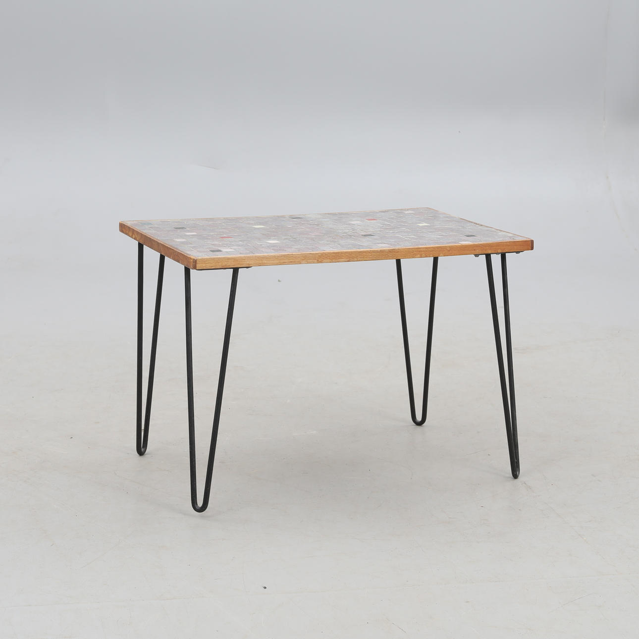 A side table, mosaic and stringed legs, mid 20th century.