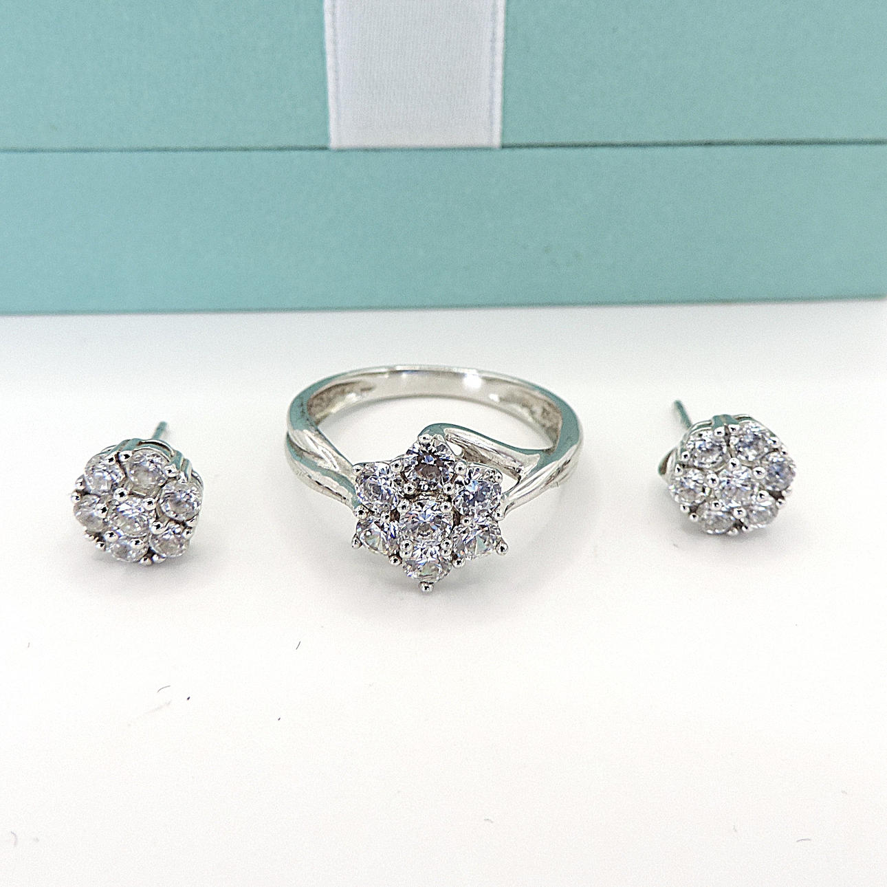STERLING SILVER SIMULATED DIAMOND RING & EARRINGS.