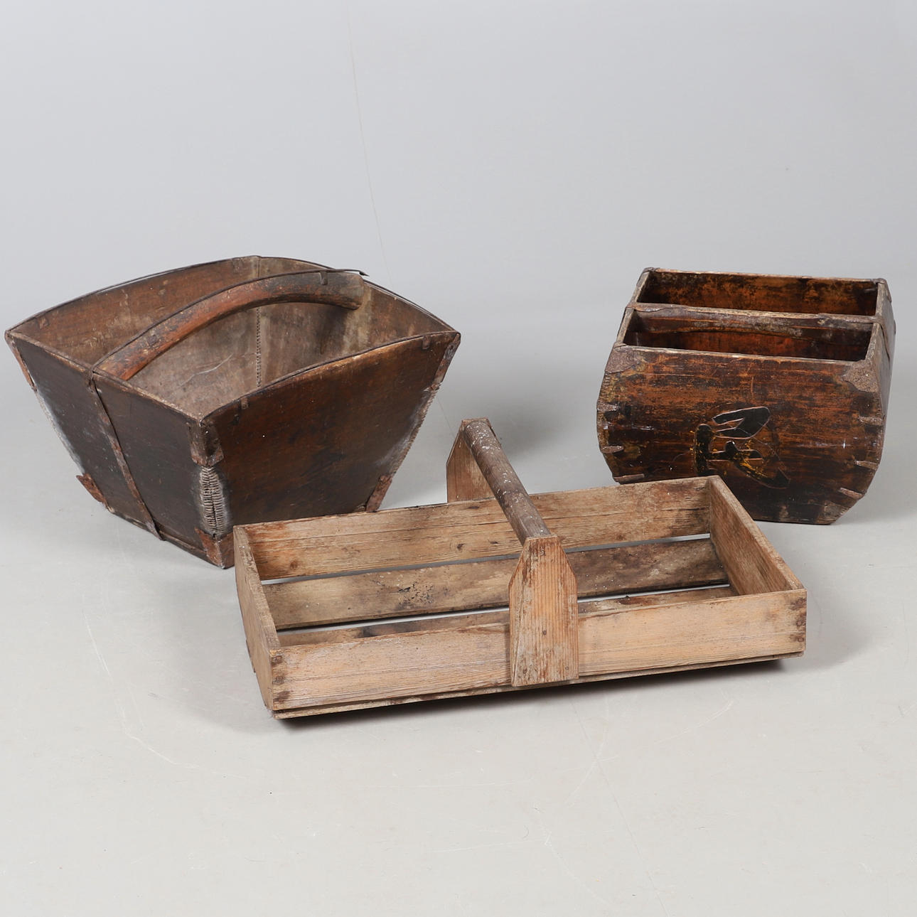 THREE SOUTHEAST ASIAN WOODEN CARRIERS.