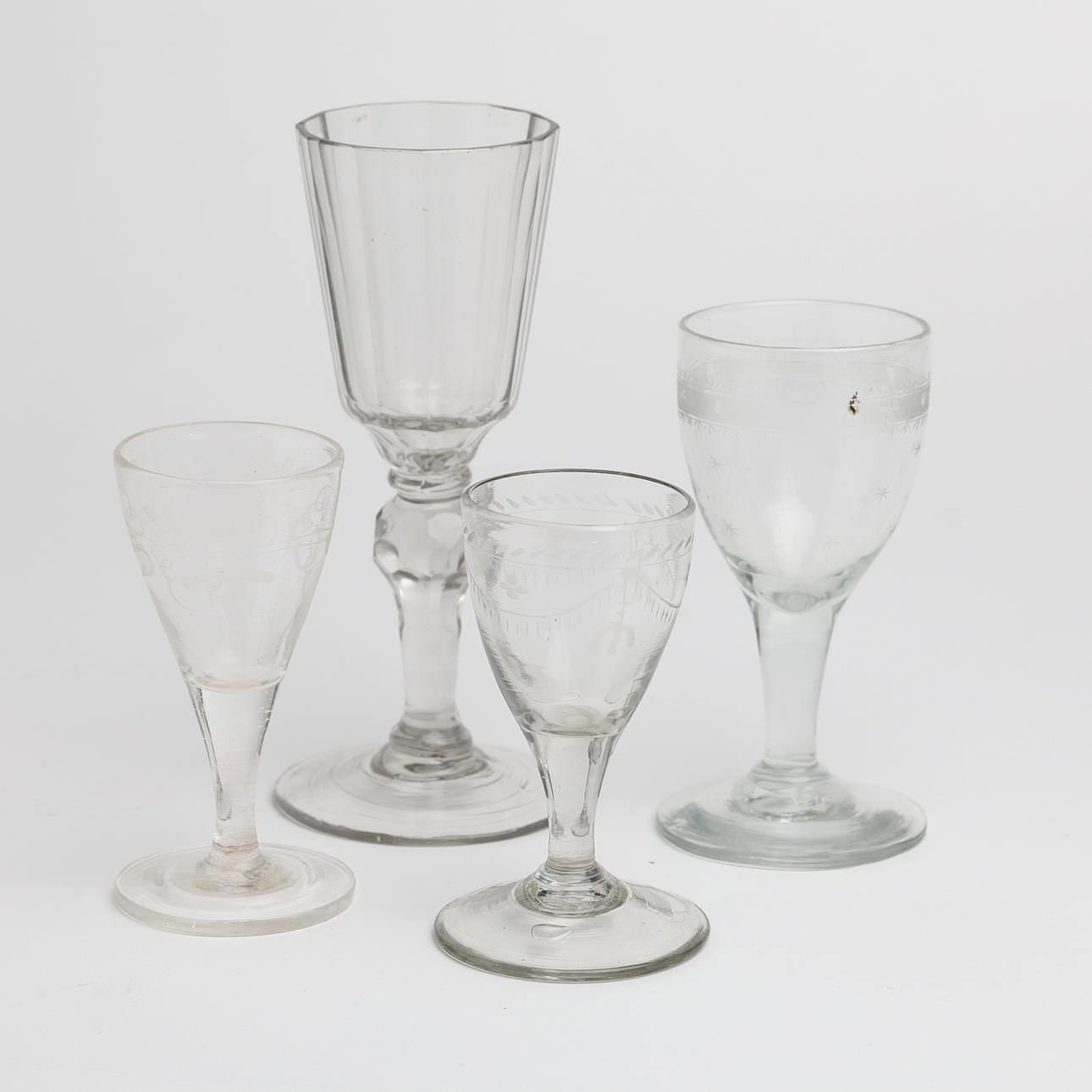 A set of four 18th/19th century wine glasses & snapsglas, 3 of which have etched decor.