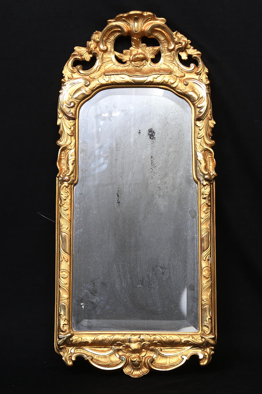 A 20th century rococo style mirror.