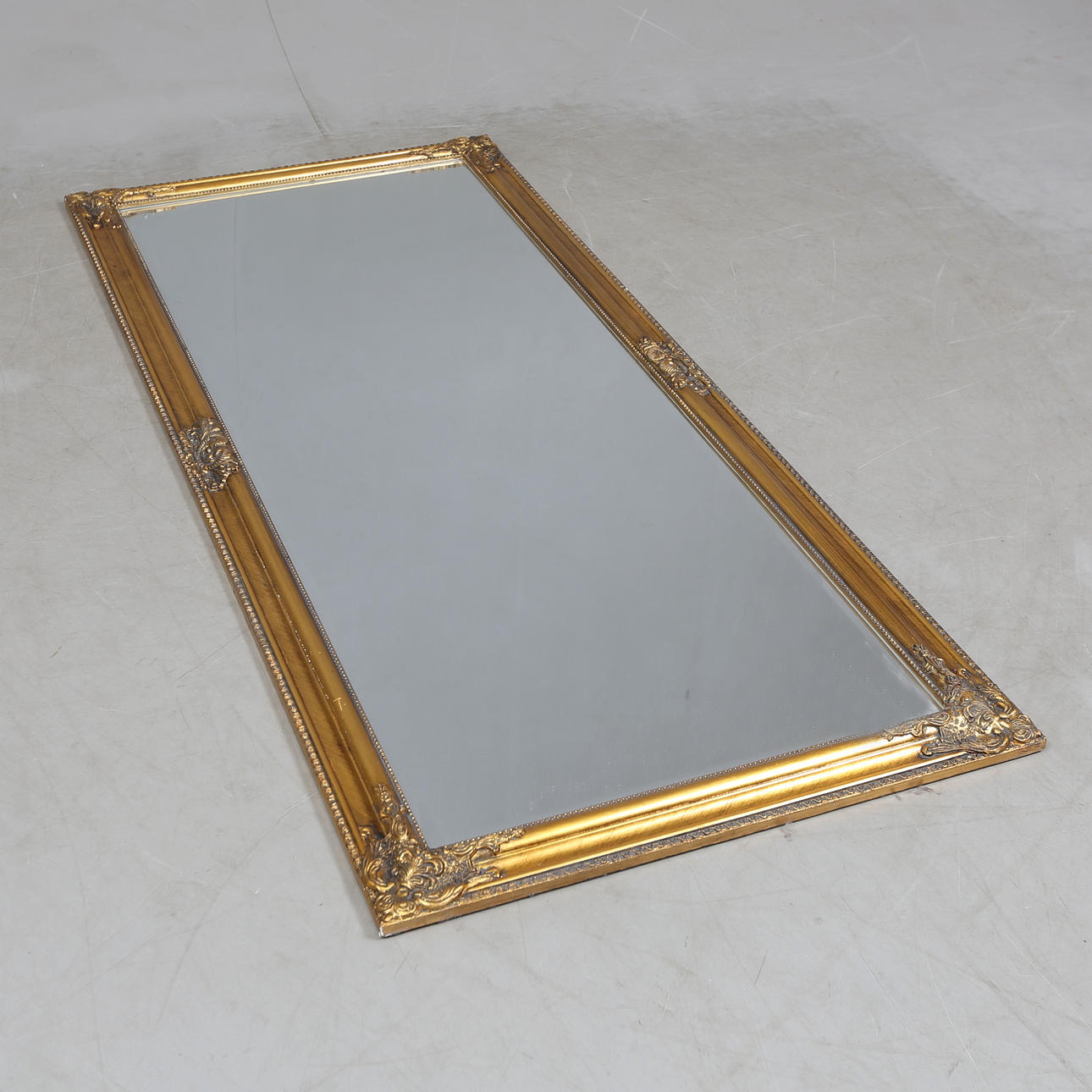 A rococo style mirror, contemporary.