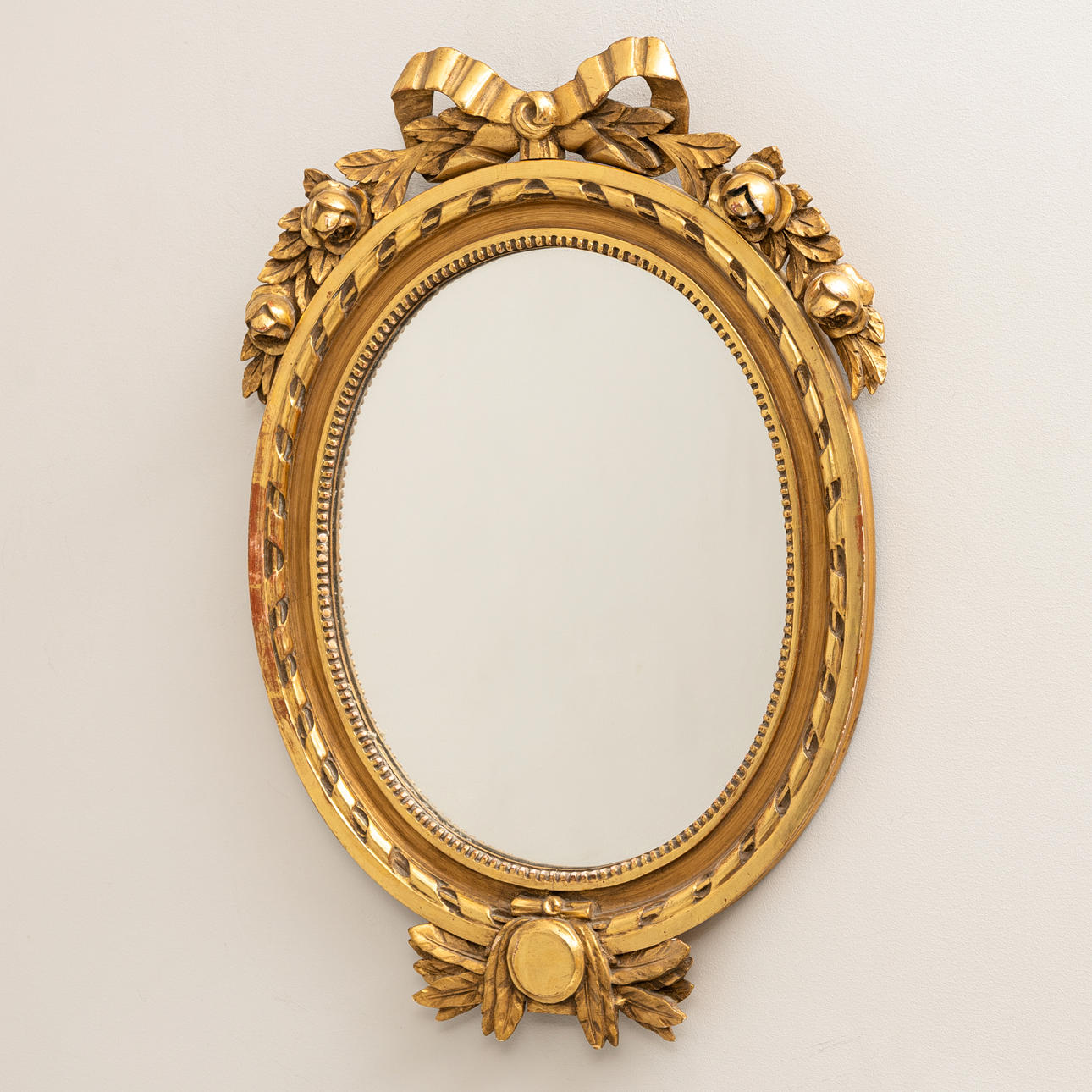 A 20th century Gustavian style gilt mirror.