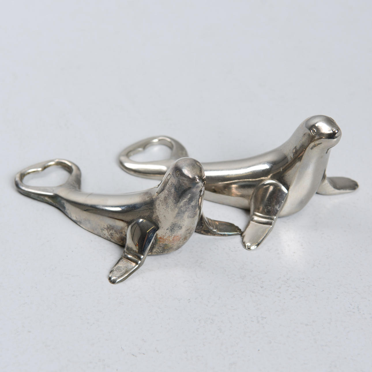 BOTTLE OPENER, a pair, metal, seals.