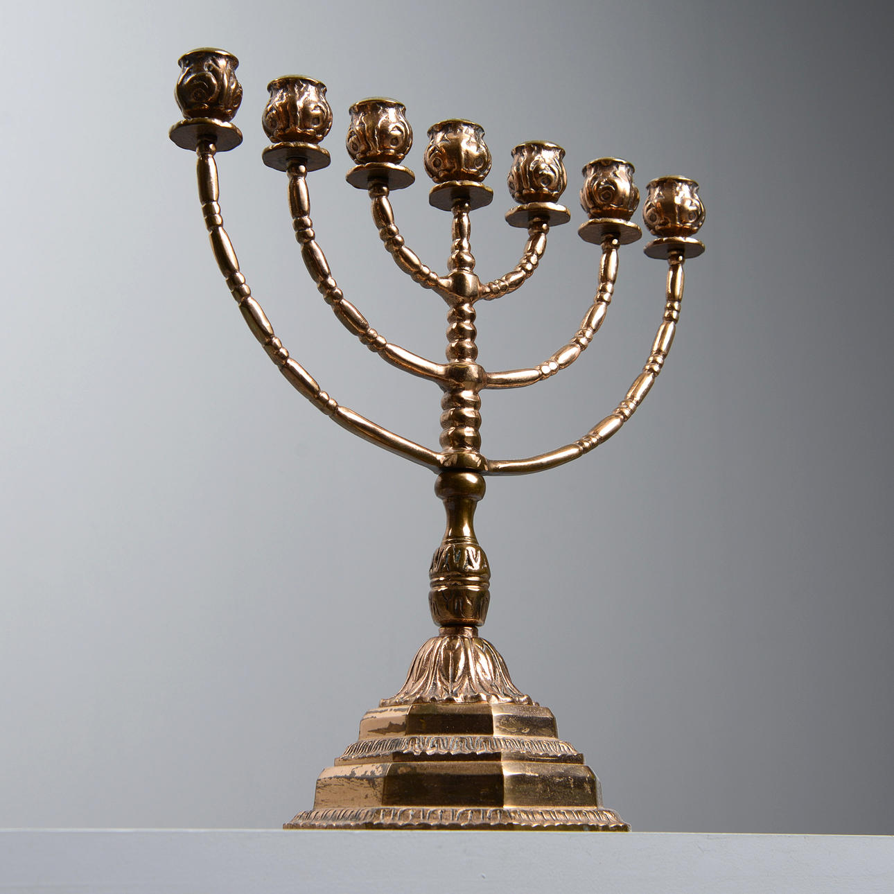 A 20th century brass menorah candelabra.