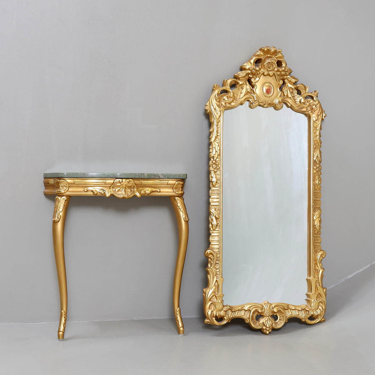A mirror with console table, Rococo style, 20th century.