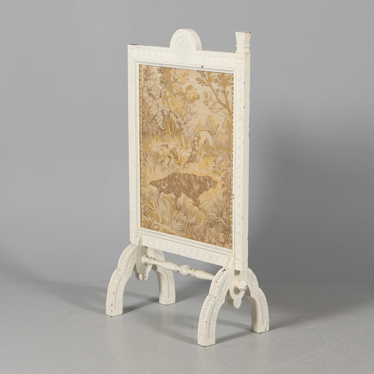 A 20th-century wood fireplace screen.