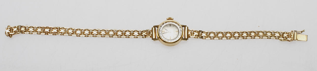 ARMBANDSUR TRAVITA MED X-LÄNK, 18k guld, total vikt ca 18.2 gr.