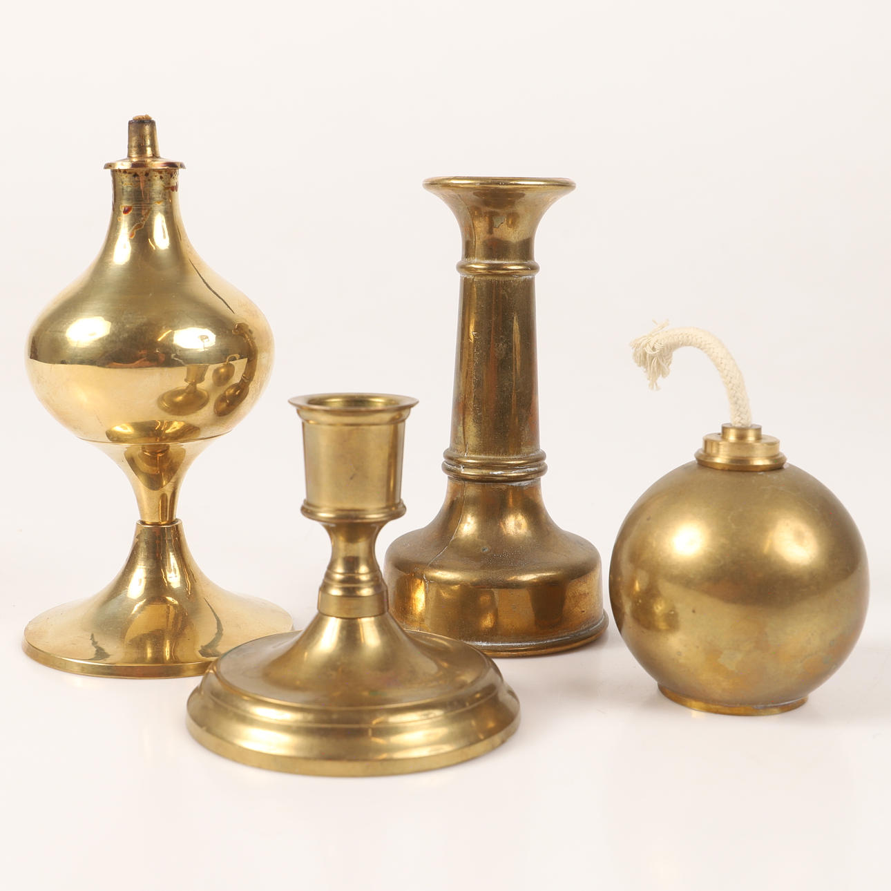 CANDLESTICKS, 3 pieces, brass, fl. a. Skultuna.