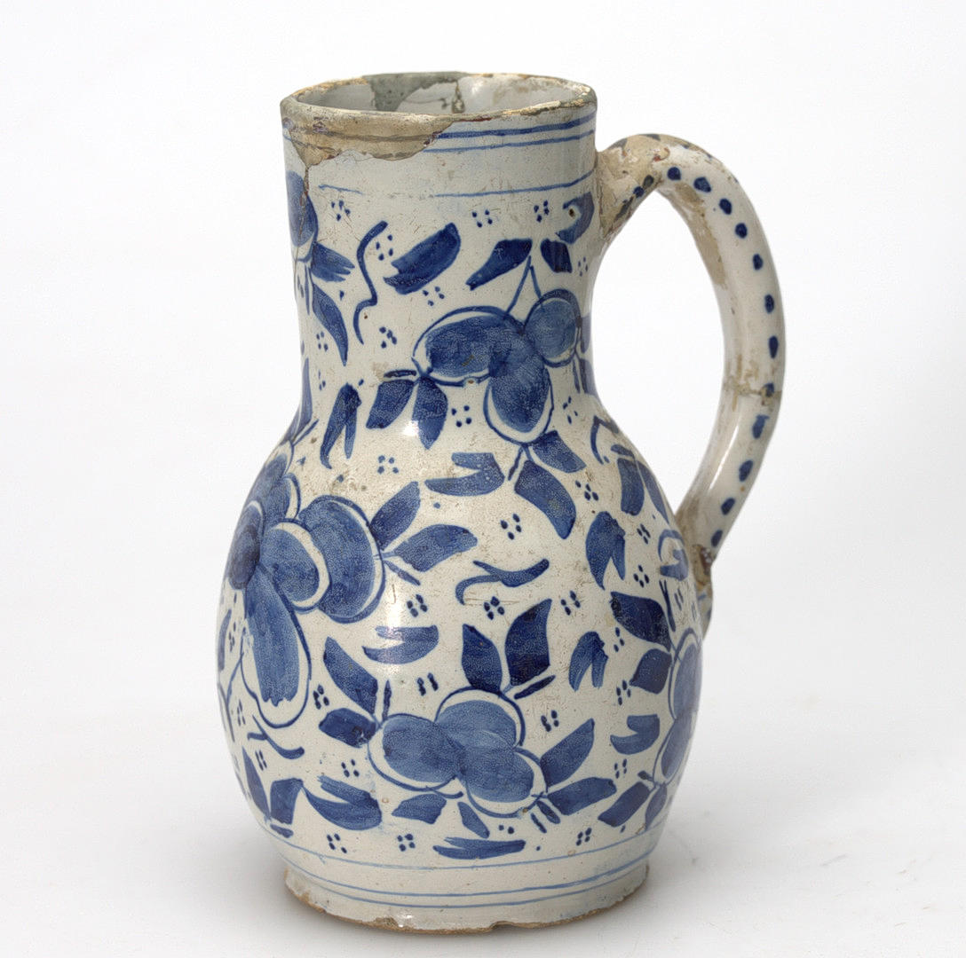 AN 18TH CENTURY FAIENCE STOP/JUG.