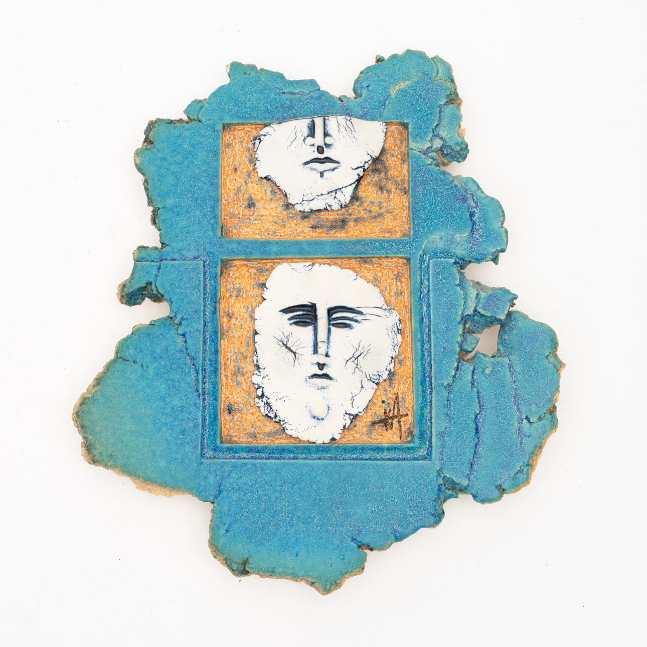 UNIDENTIFIED ARTIST, wall relief with faces, earthenware.