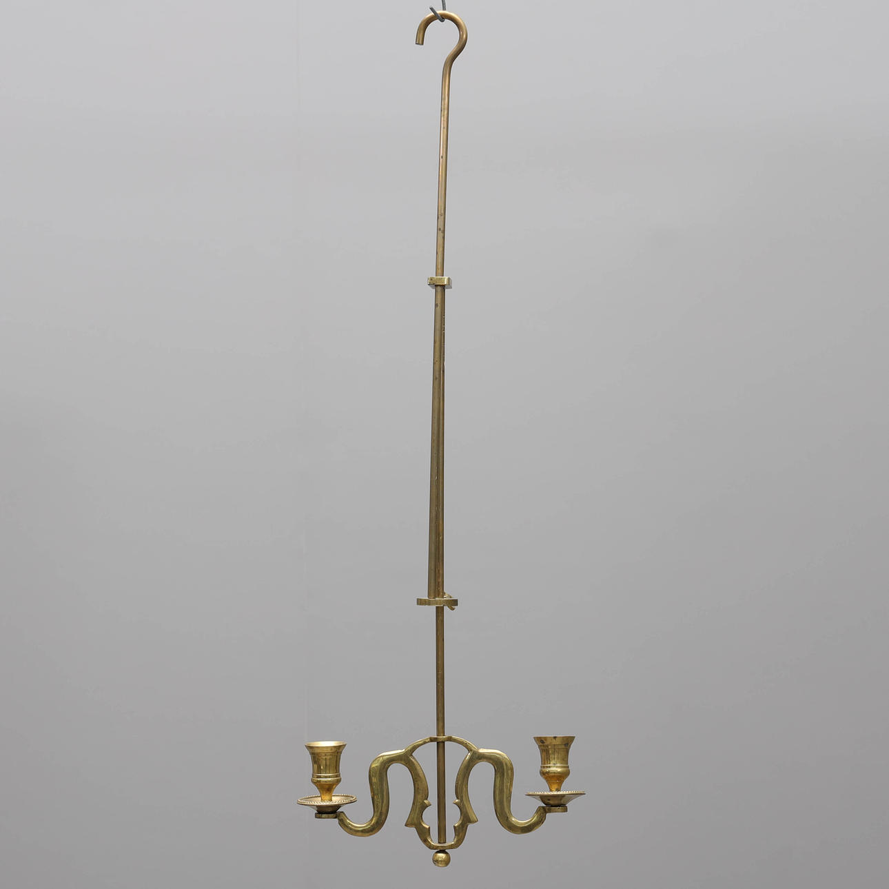 A brass ceiling candlestick, height & adjustable, 20th century.