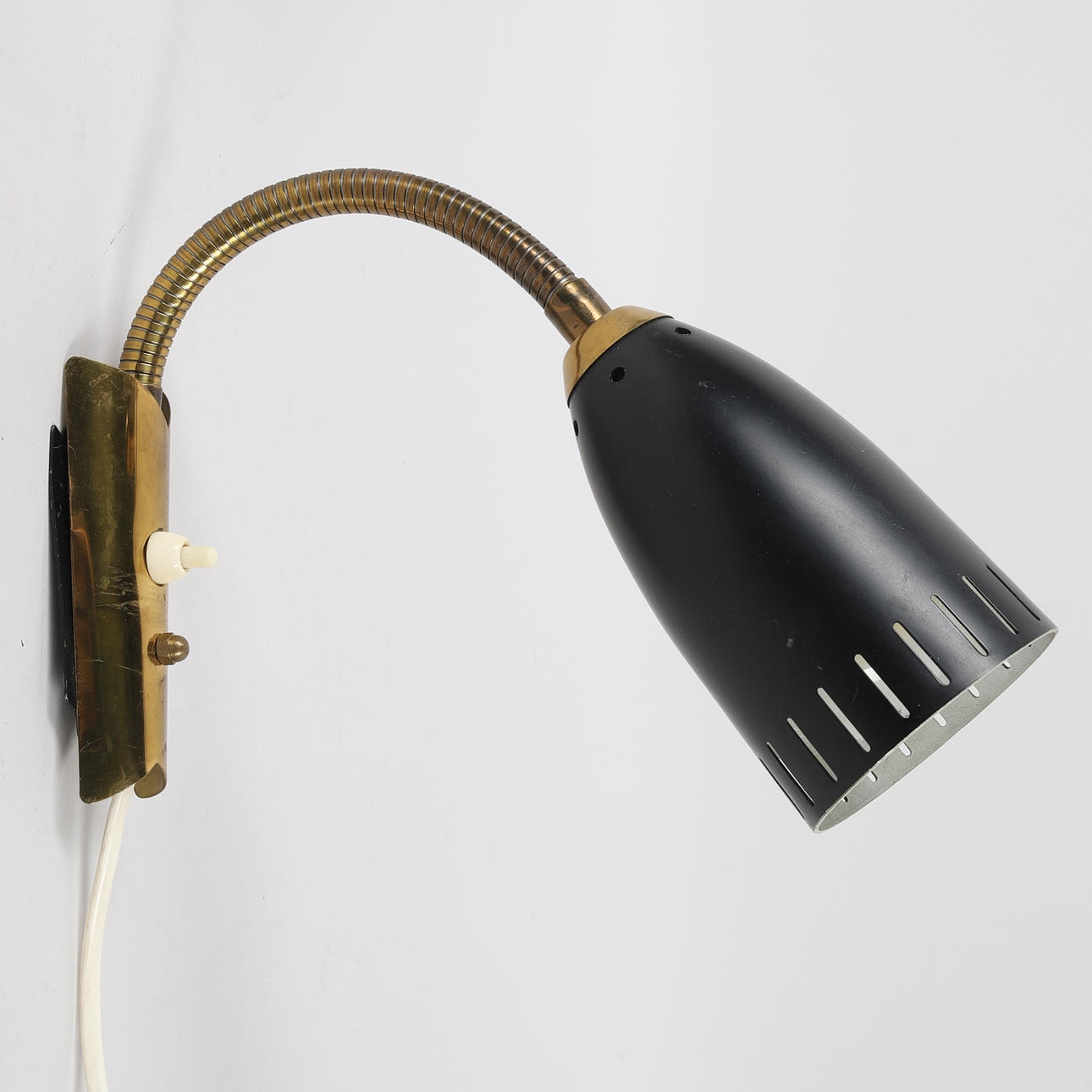 A 'Ringus' brass/metal wall lamp, 1950/60s.