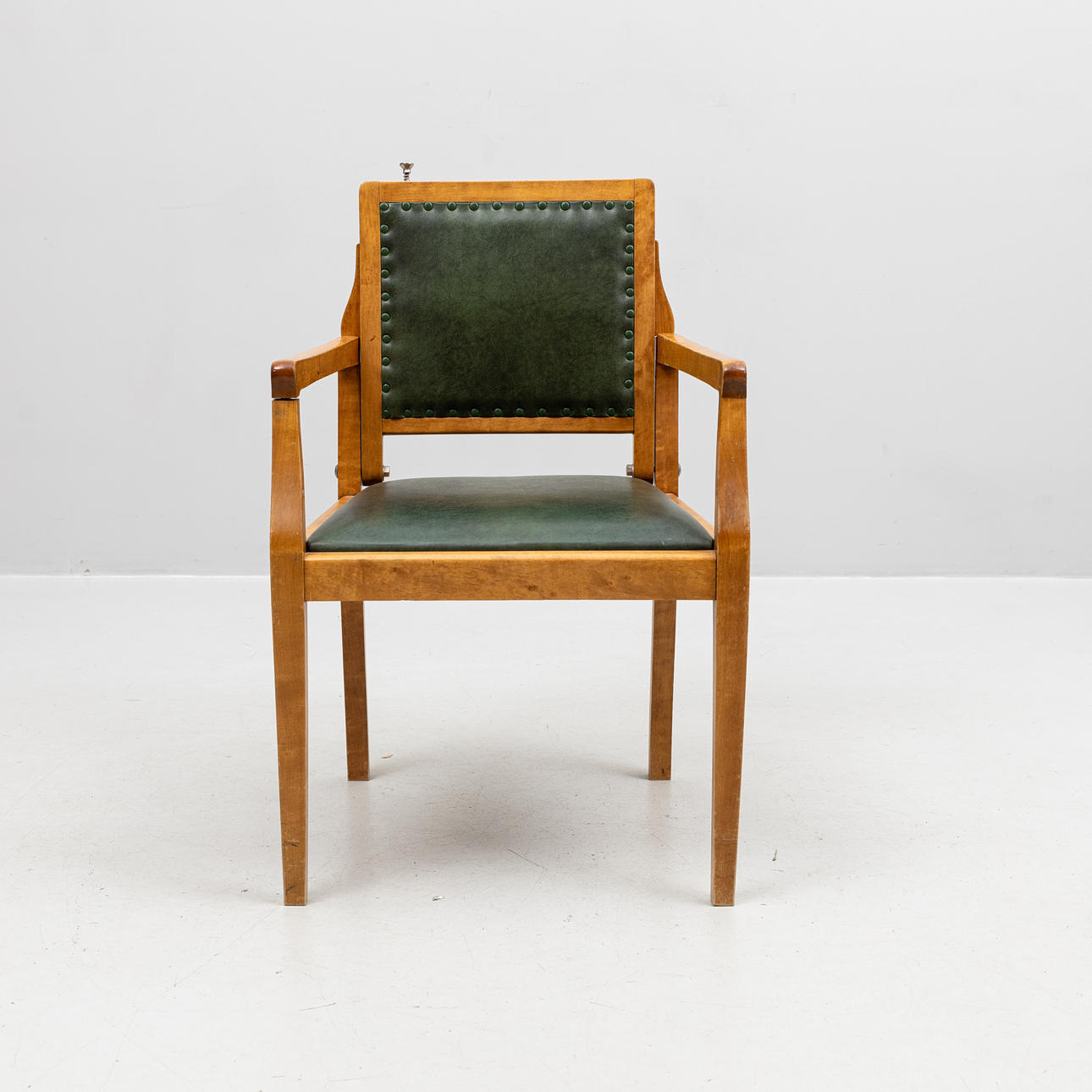 An armchair, with folding back, barber's chair, beech, artificial leather, first half of the 20th century.