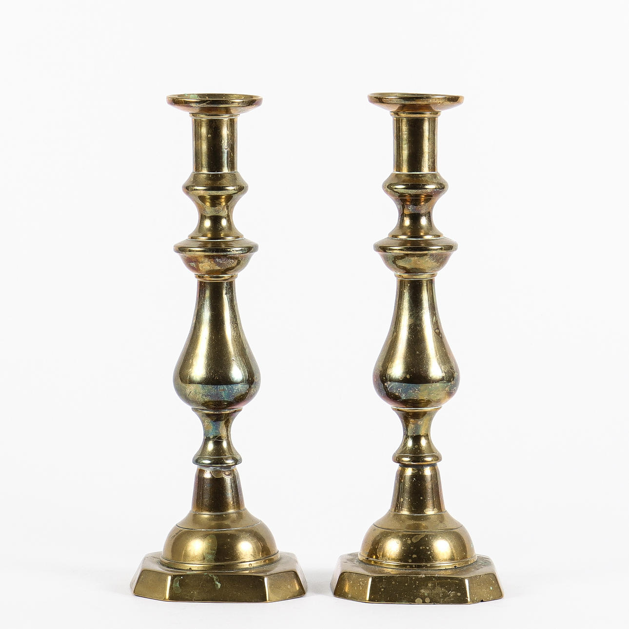 A pair of brass candlesticks.