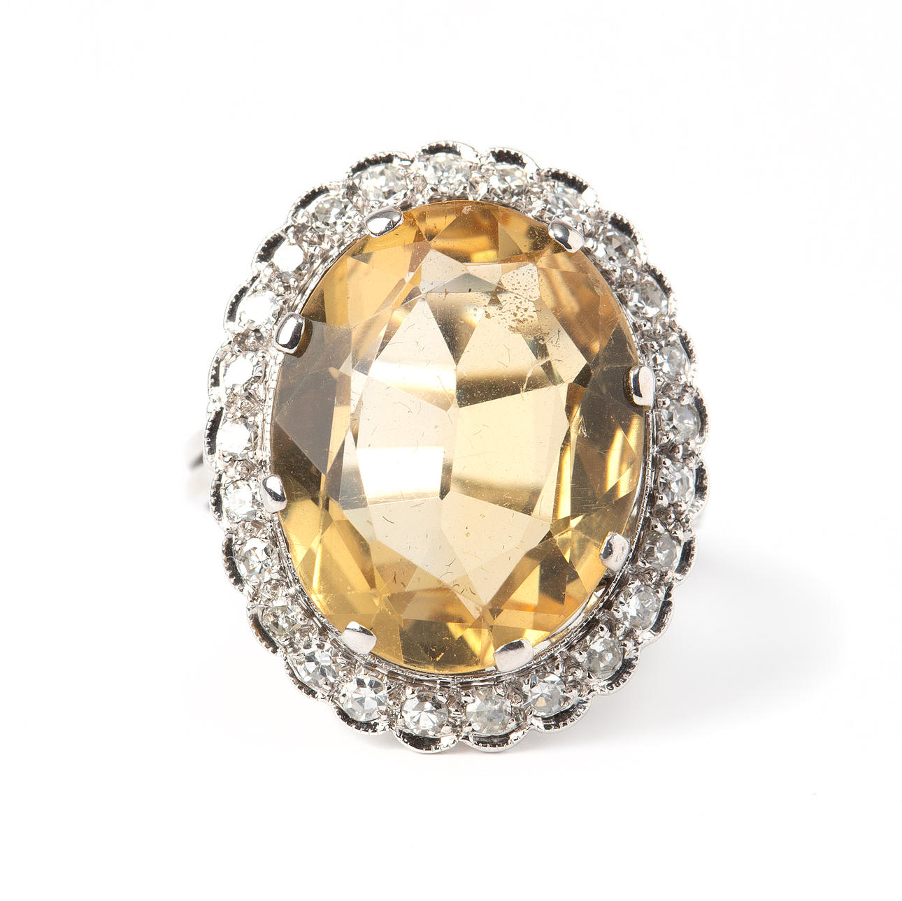 RING, 14K white gold with octagonal cut diamonds in total approx. 0.25 ct and oval-cut citrine.