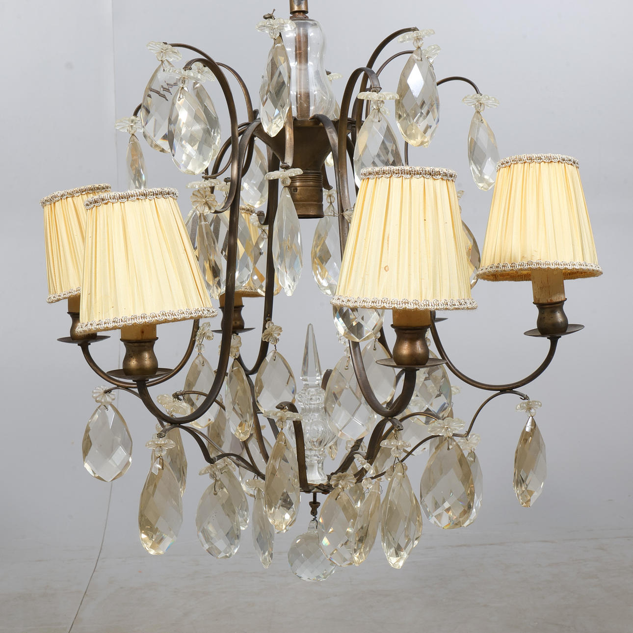 A BAROQUE CRYSTAL CHANDELIER.