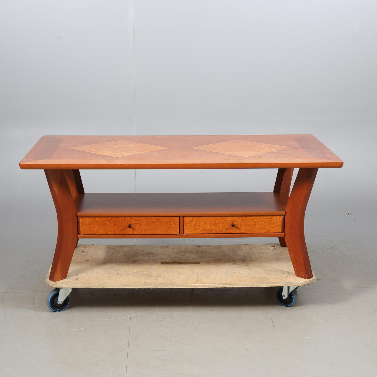 A 20th century intarsia coffee table.