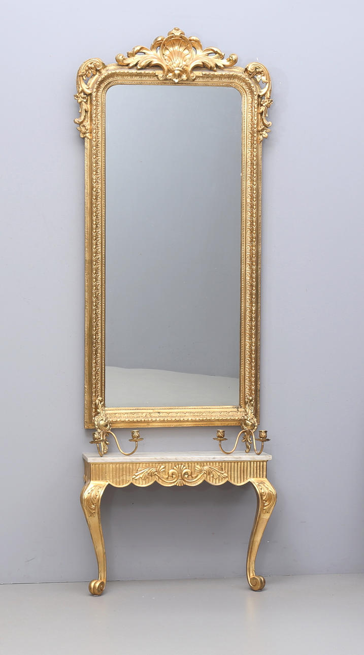 A 20th century mirror with console table and sconces.