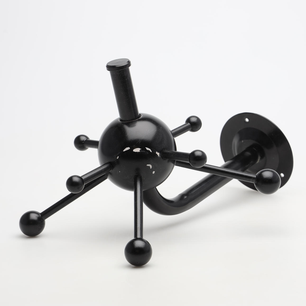 OSVALDO BORSANI. A clothes hanger, “Sputnik”, IKEA.