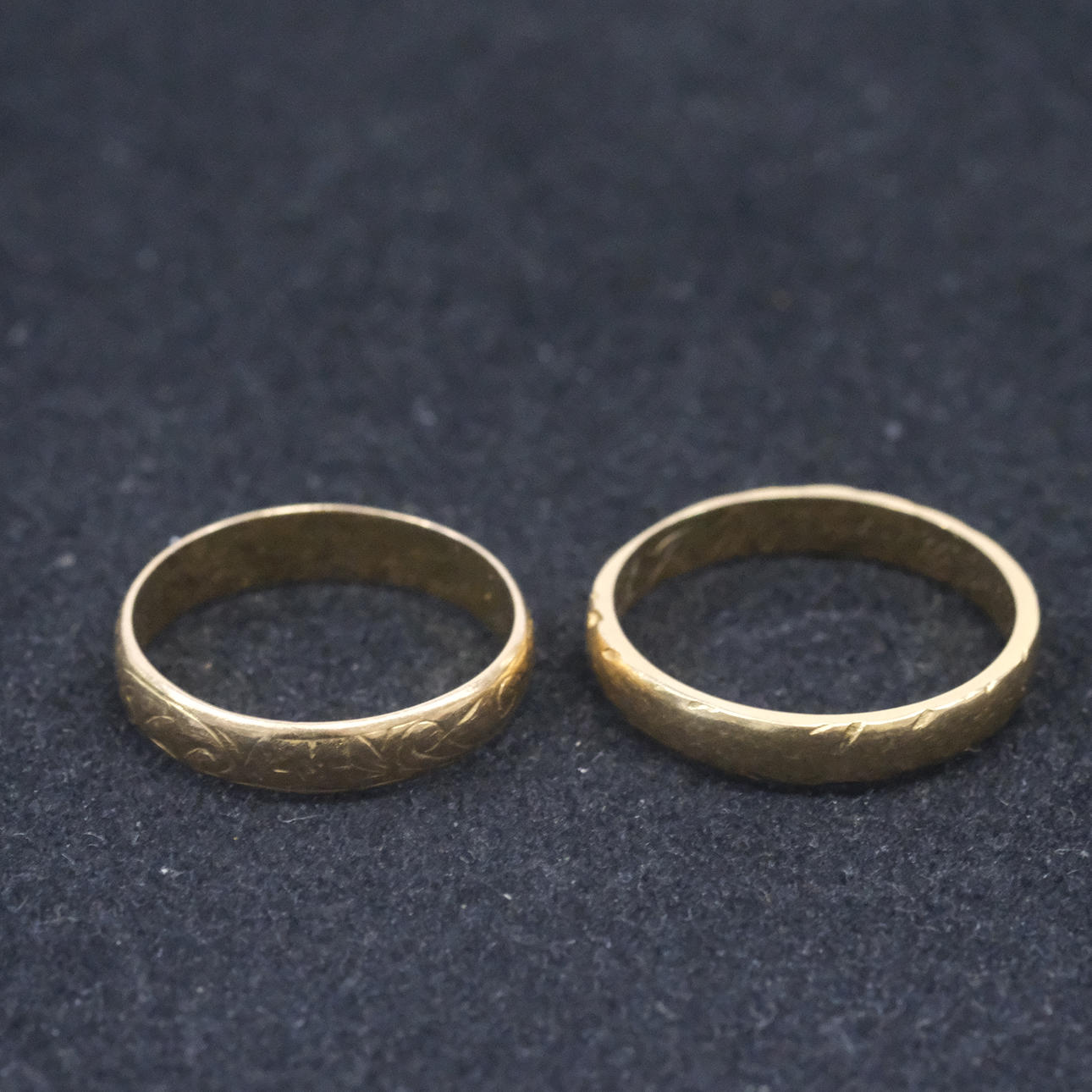 TWO SMOOTH RINGS, 18K GOLD.