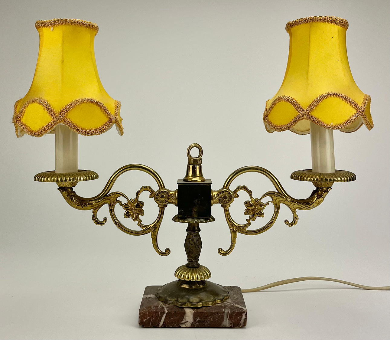 A brass table lamp, stone base, 20th century.