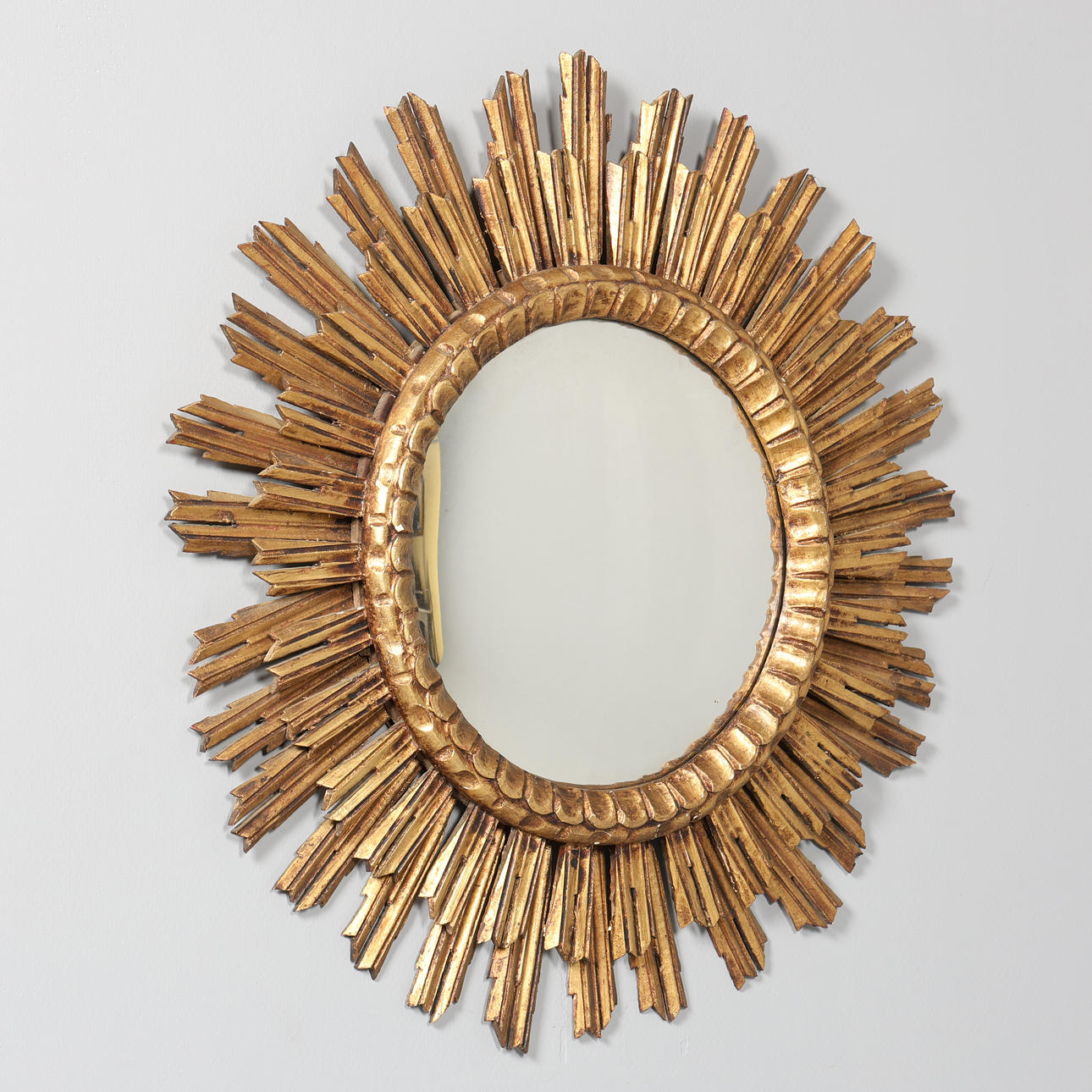 SUN MIRROR, gold colored wooden frame.