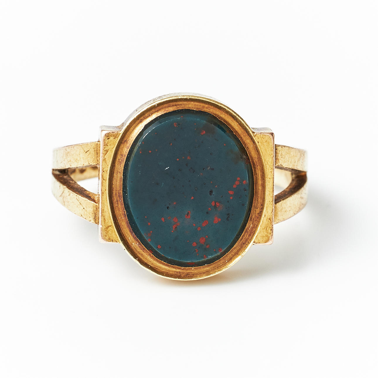 RING, 14k gold, plane cut heliotrope, foreign stamps.