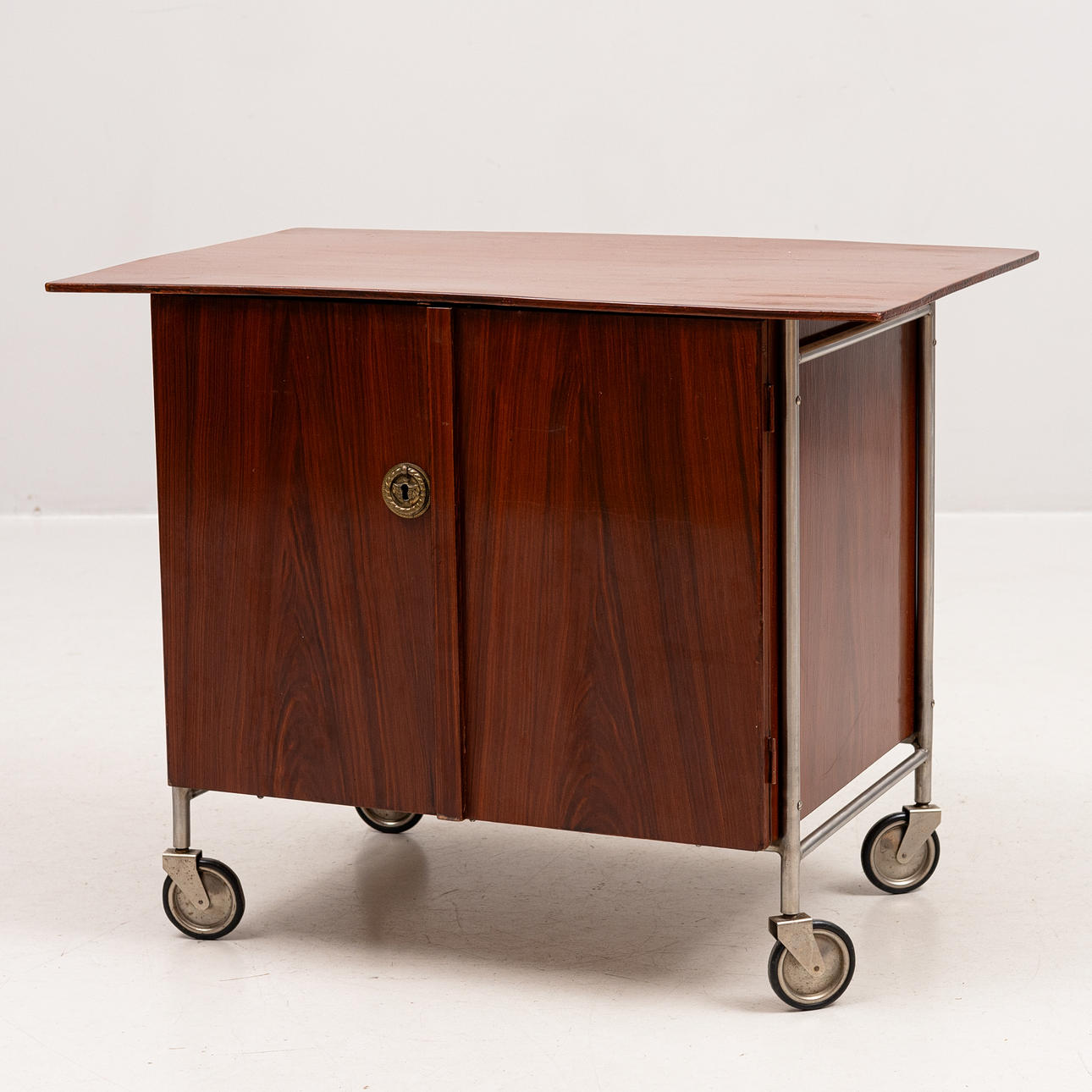 A wheeled bar cabinet, 1950s/60s.