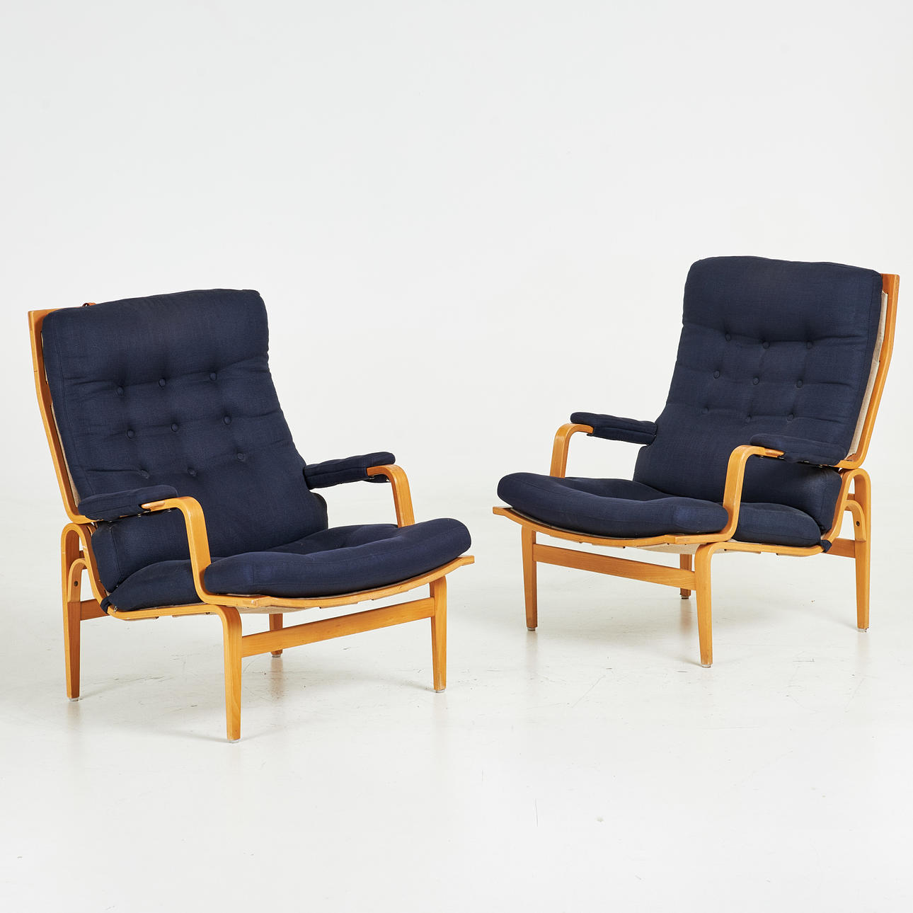 BRUNO MATHSSON. “Ingrid high”, armchairs, 1 pair, Dux, laminated frame in beech, canvas, loosely lying plush mats, upholstered buttons.