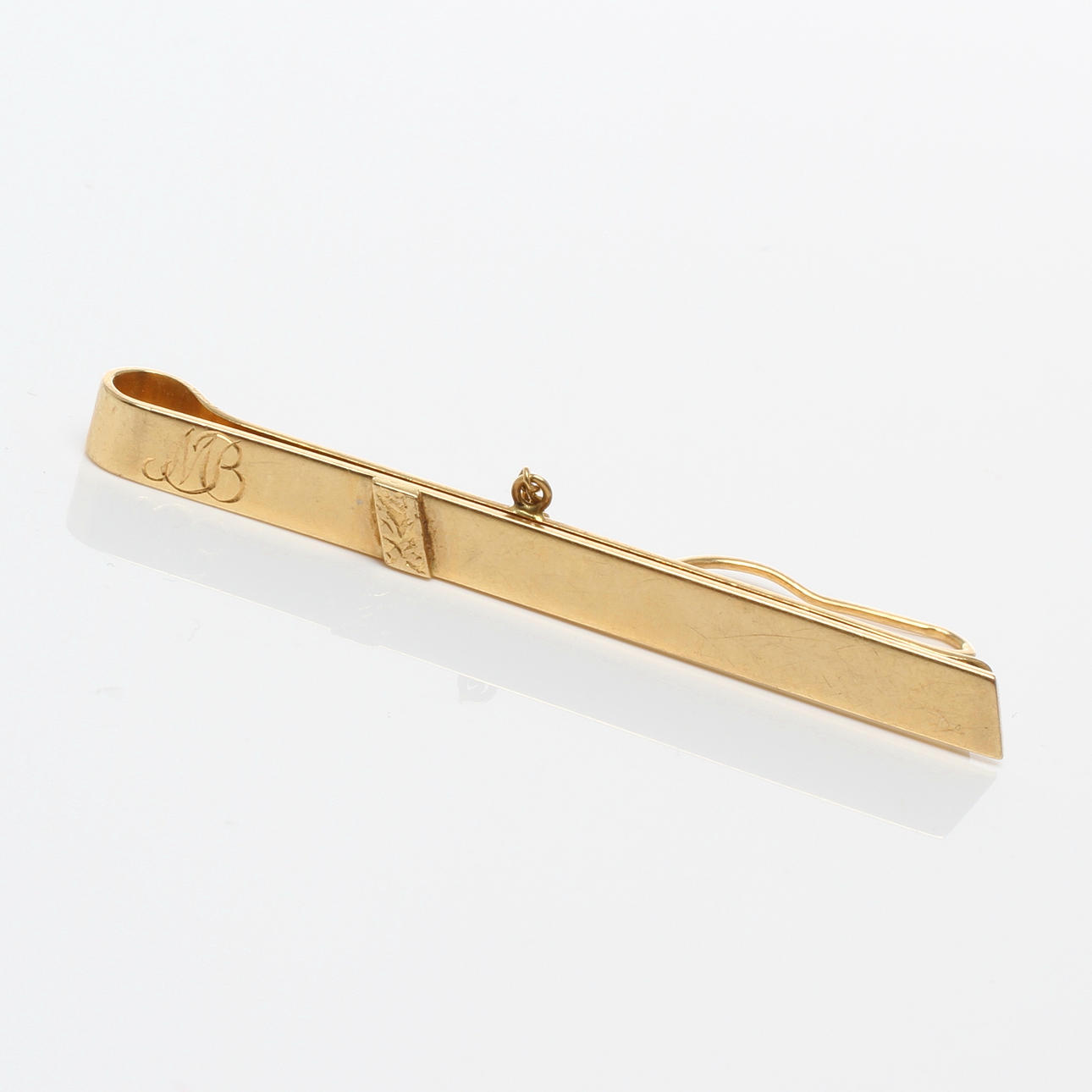SLIPSKLÄMMA, 18k guld, Stigbert / Engelbert, Stockholm, 1985.