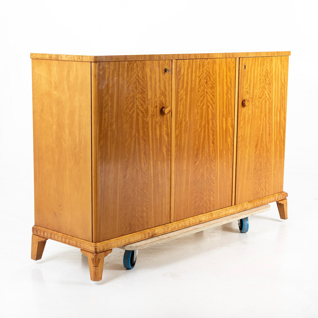 A 1940s/50s intarsia cupboard.