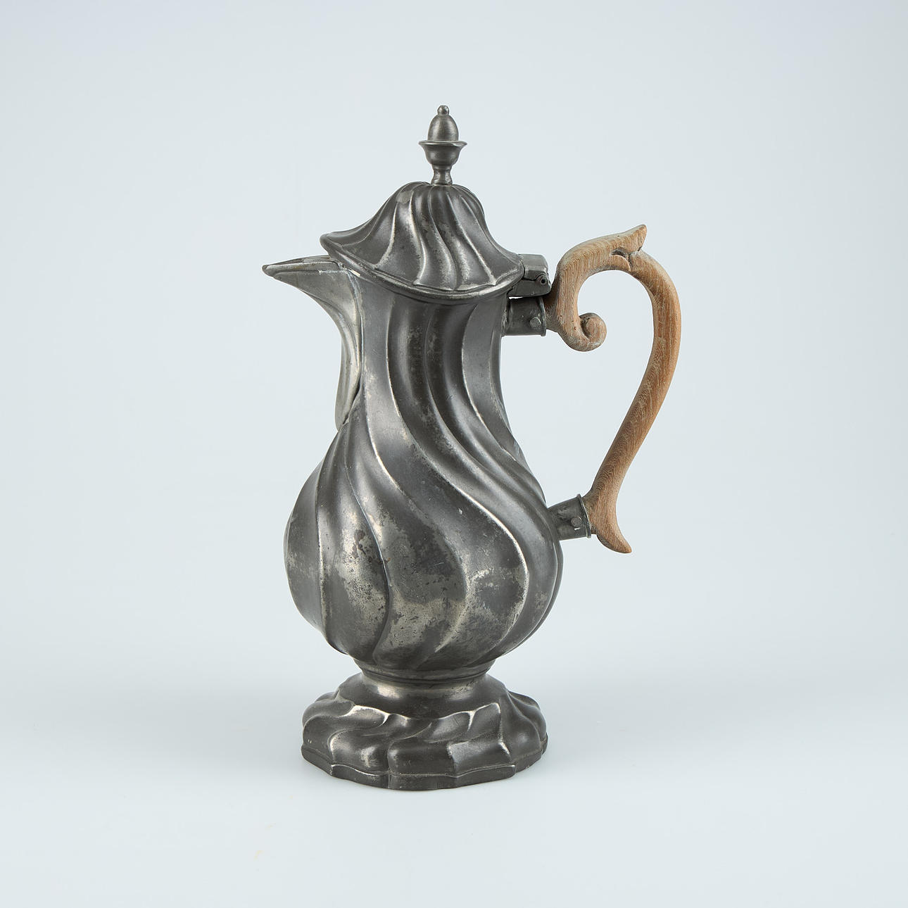 A rococo tin jug, 18th century.