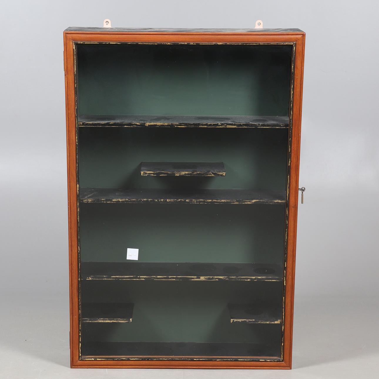 A GLAZED WALL MOUNTED DISPLAY CABINET.