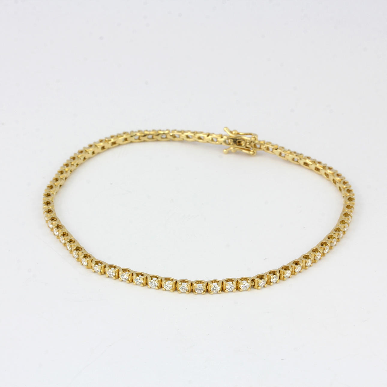 18CT GULD DIAMANT TENNISARMBAND.