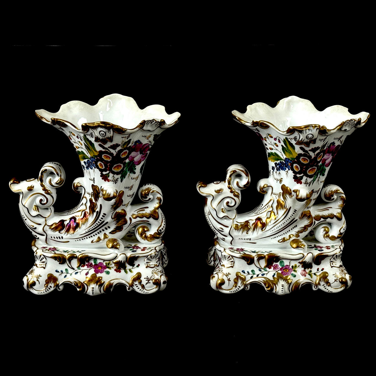 PORCELAIN CORNUCOPIA VASES.