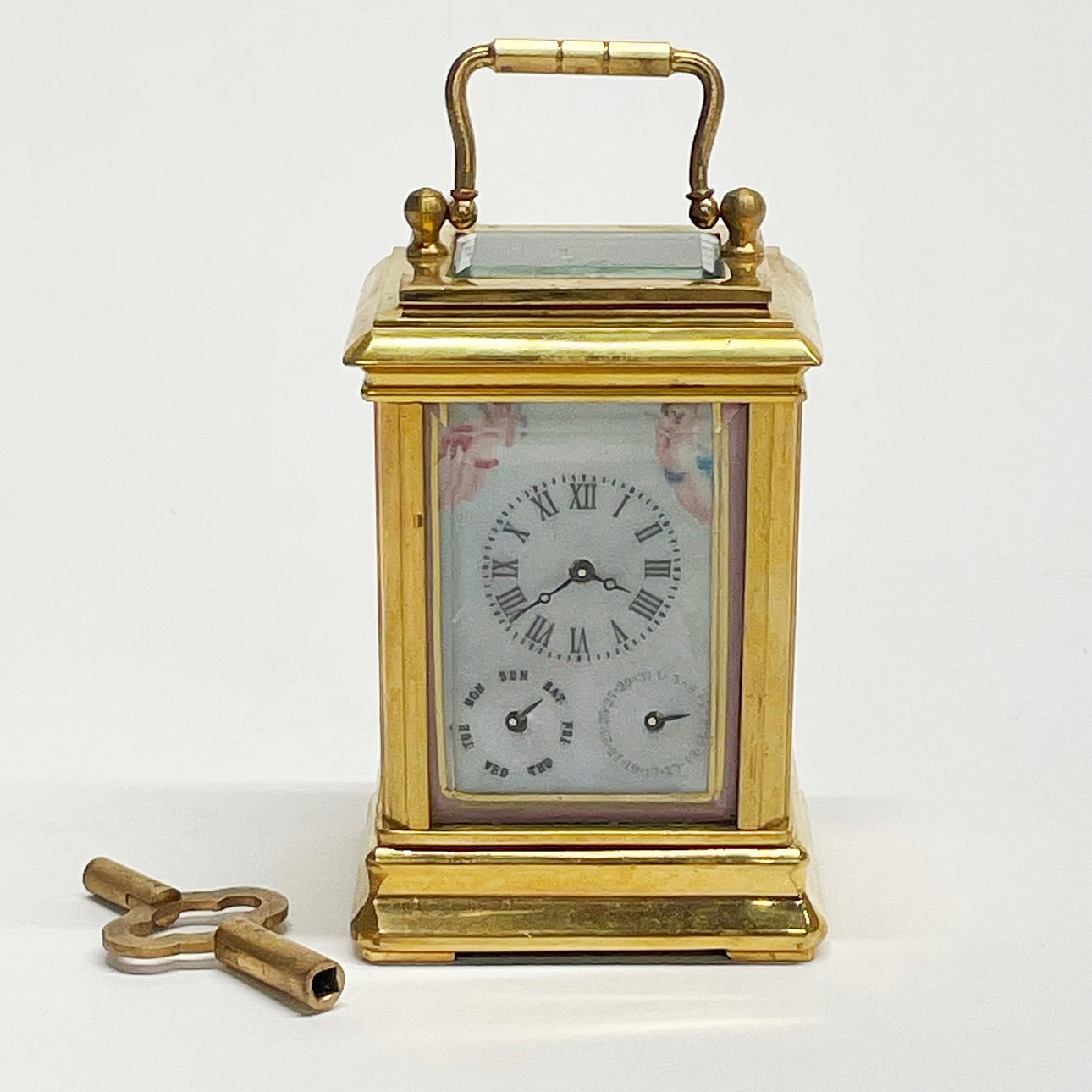 MINIATURE BRASS CARRIAGE CLOCK.