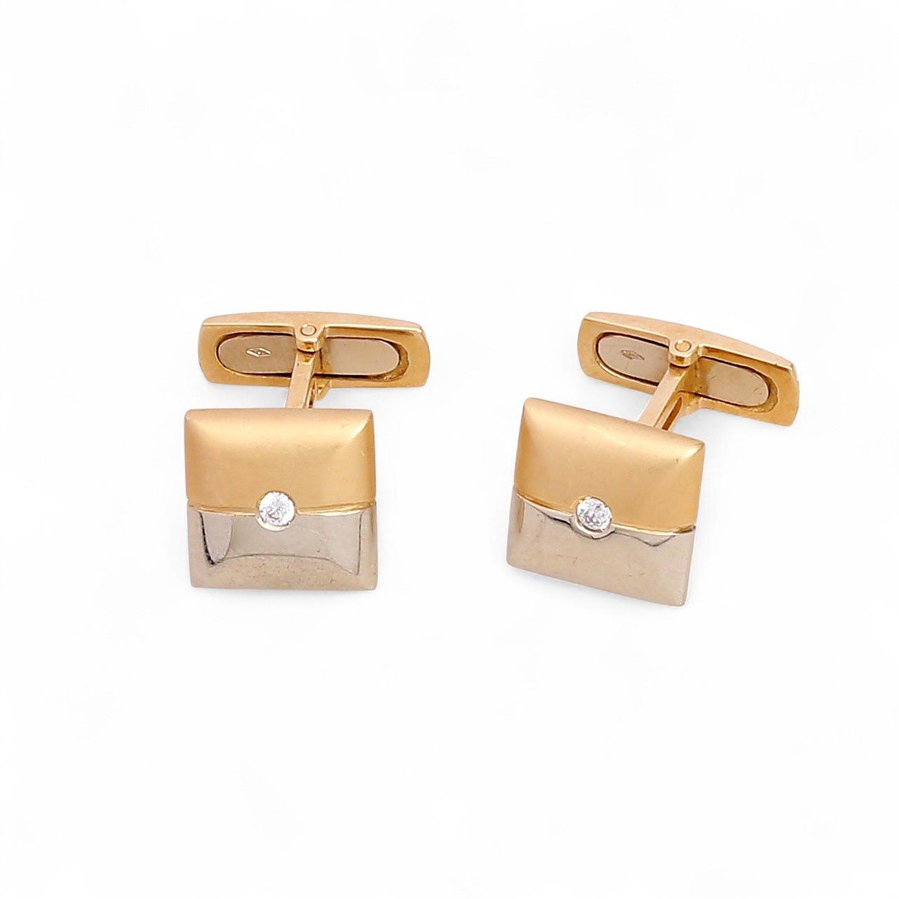 Two-tone gold cufflinks.
