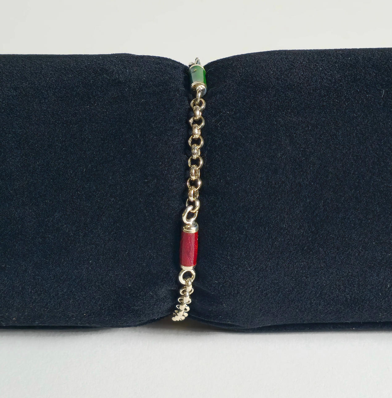 SILVER BRACELET DECORATED WITH ENAMELED CYLINDERS.