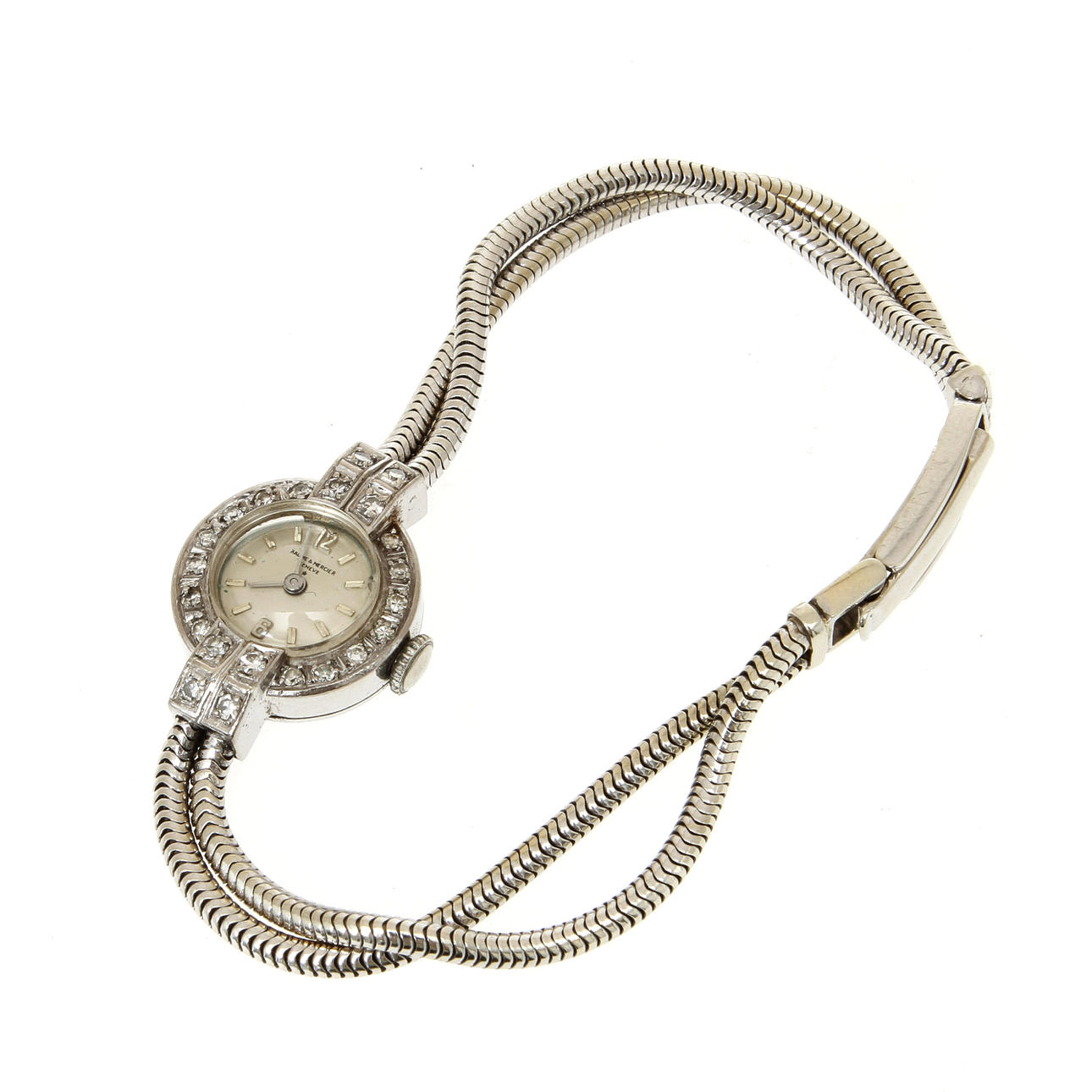 DAMARMBANDSUR, Baume & Mercier, 18k vitguld med 22 st små diamanter, totalvikt 23,2 gram.